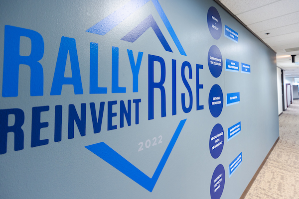 Rally Reinvent Rise wall paint and branding